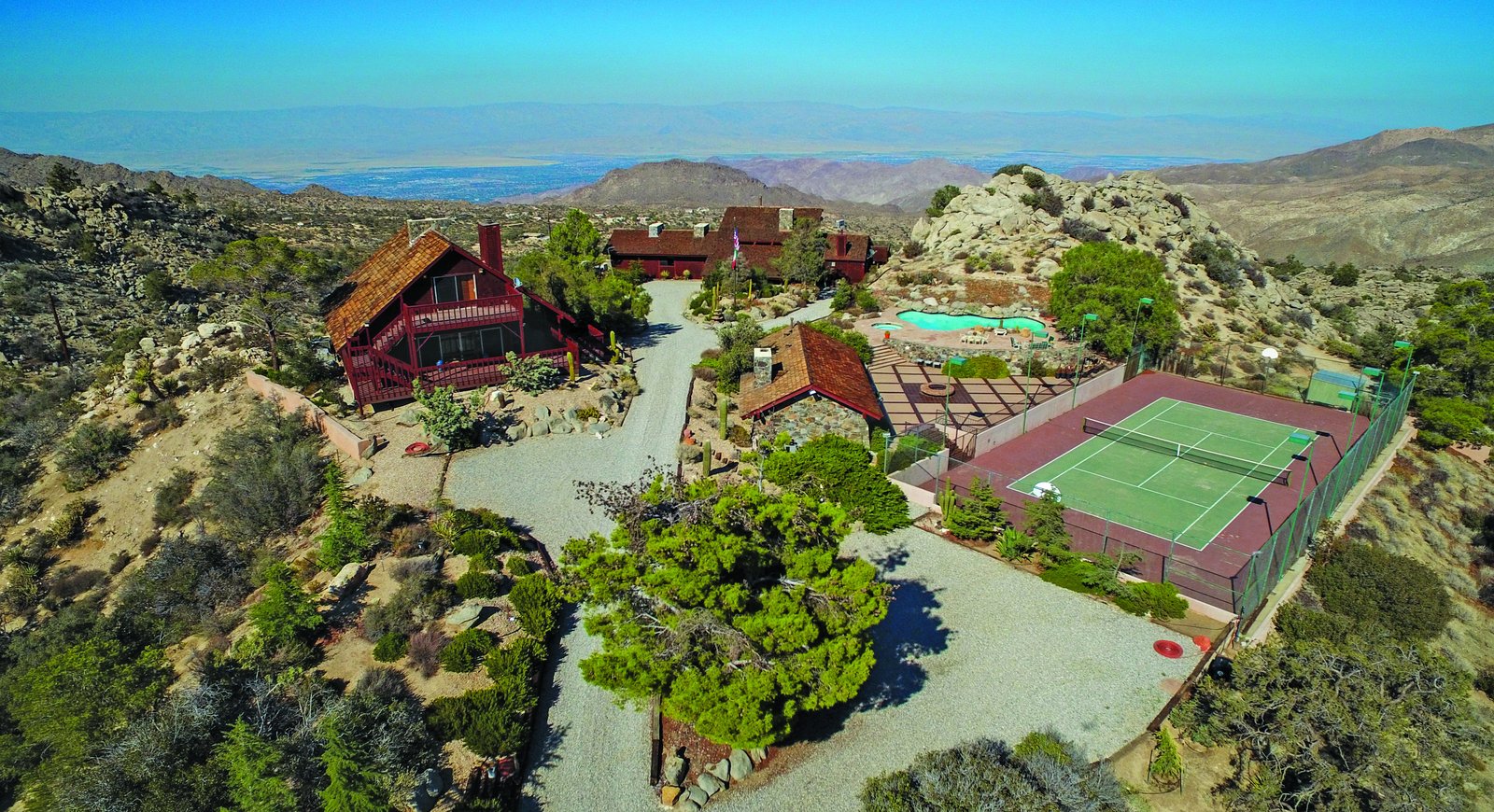 Aerial view of Frank Sinatra's Villa Maggio compound in Palm Desert, showing main lodge, guest house, pool, and tennis court at 4,300 feet.